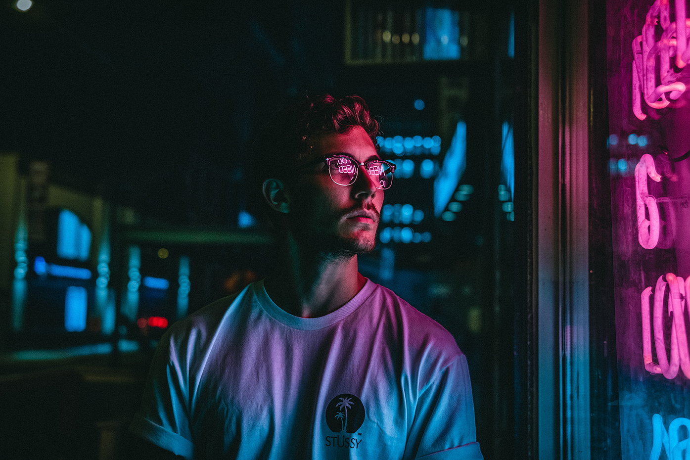 guy in front of neon lights